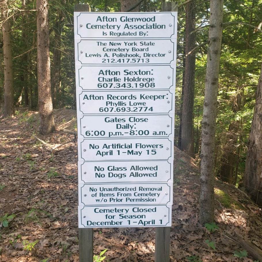 A sign in the woods

Description automatically generated with medium confidence